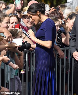 Meghan meets members of the public on a walkaboutin 2018 in Rotorua, New Zealand