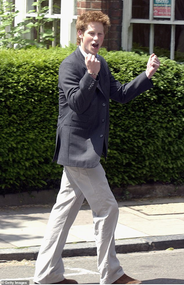 Prince Harry clenches his fist as he leaves Eton College for the last time in June 2003