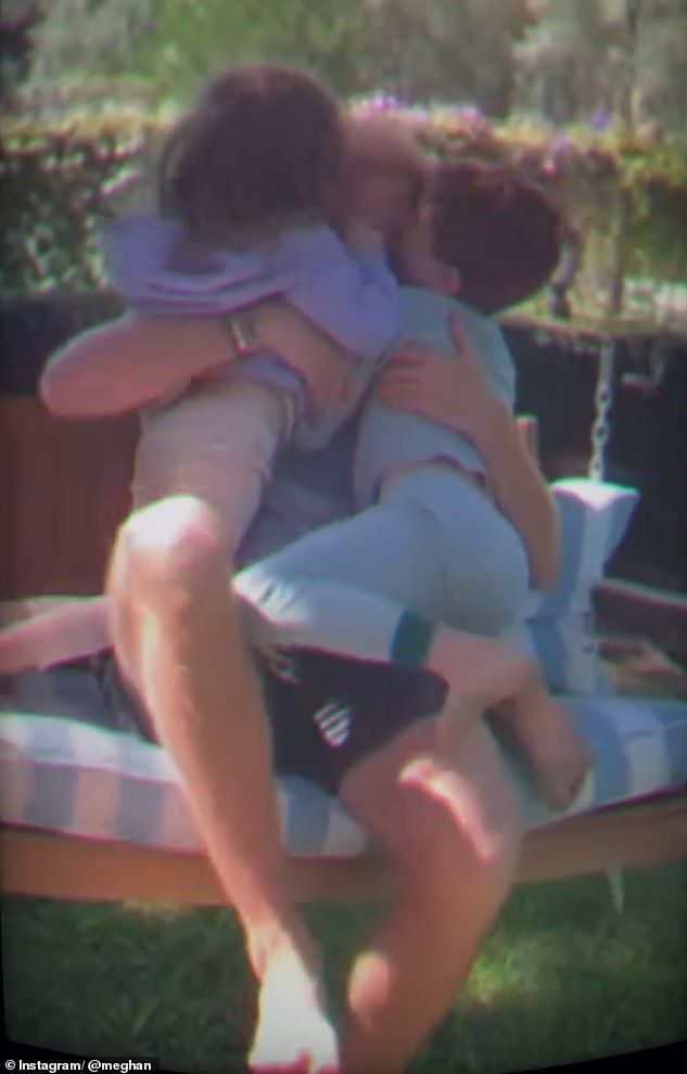 Harry appears to be every inch the doting father - and in another video, he snuggled his children while sat on a swing