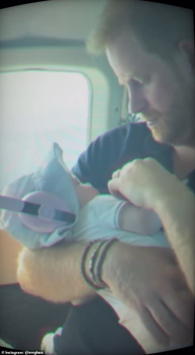 In another sweet moment, Lilbiet donned pink protective headphones as she slept in her father's hands