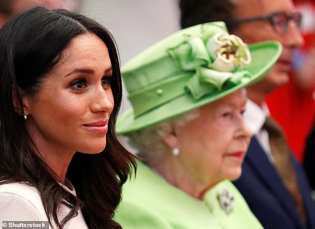 The late Queen with Meghan in 2018. According to royal author Valentine Low, any prospect of a soft 'Megxit' was scuppered by the Sussexes over finances