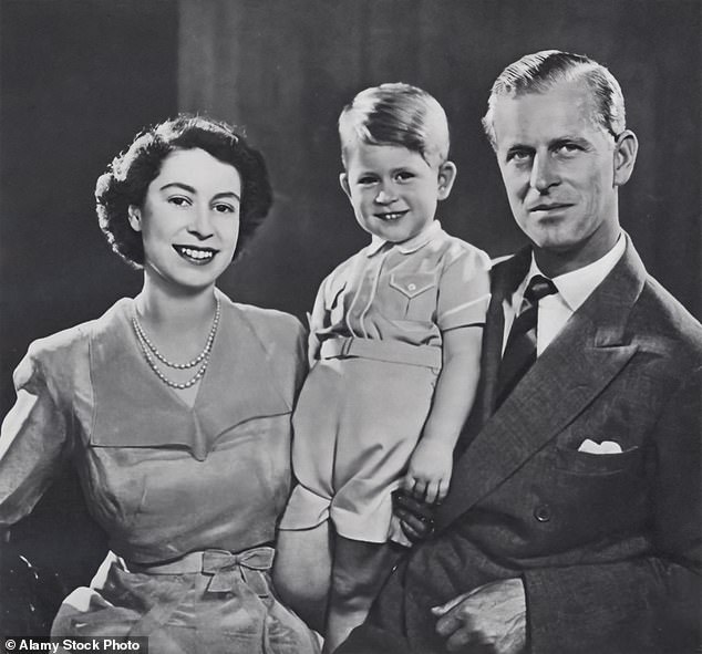 The late queen and late Duke of Edinburgh are pictured with Charles months before his third birthday in 1952