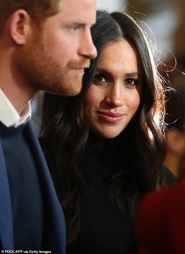 Prince harry and his then-fiancée Meghan Markle during their first trip to Scotland. According to royal biographer Tom Bower acted 'distinctly unroyal' during the visit