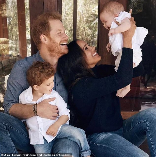 During a walkabout on a joint engagement with Meghan when she was six months pregnant with Archie, in January 2019, Harry (pictured with his wife and their children) seemingly discussed name choices for their firstborn
